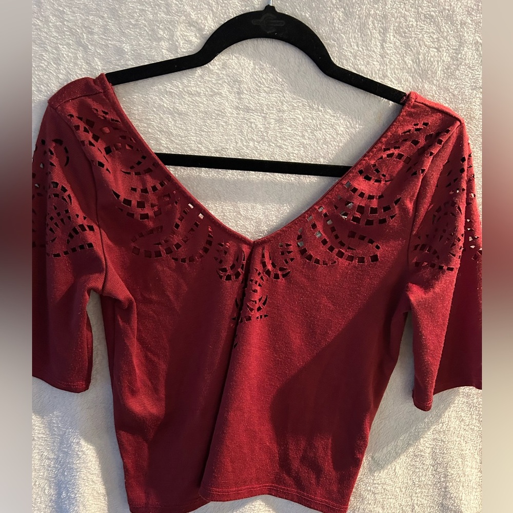 Cutout v neck red top with midlength sleeves
